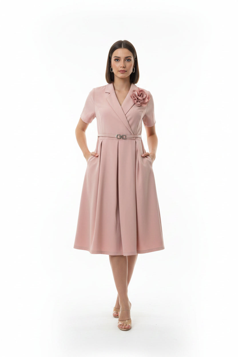 Pink trench coat with a floral accessory and a waist belt