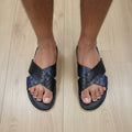 Pair of black and blue sandals 